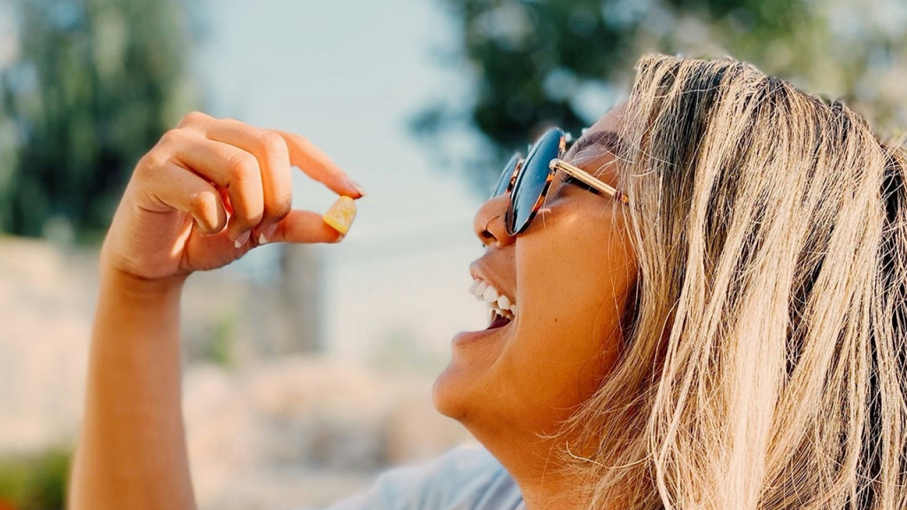 Woman enjoying a live resin edible under the sun